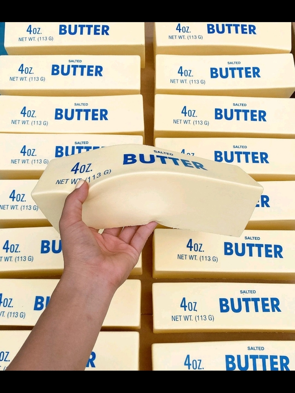 Butter Squeeze Toy - Creamy Yellow with Blue Logo